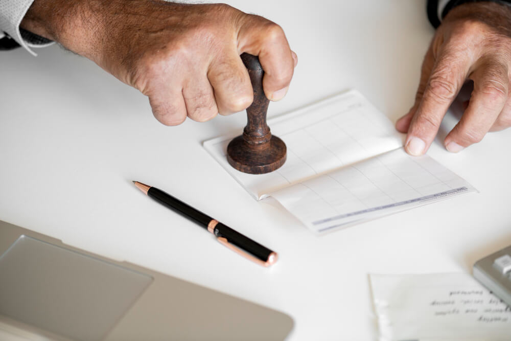 a person stamping on the page